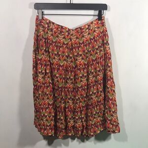 Fall print pleated knee length skirt.